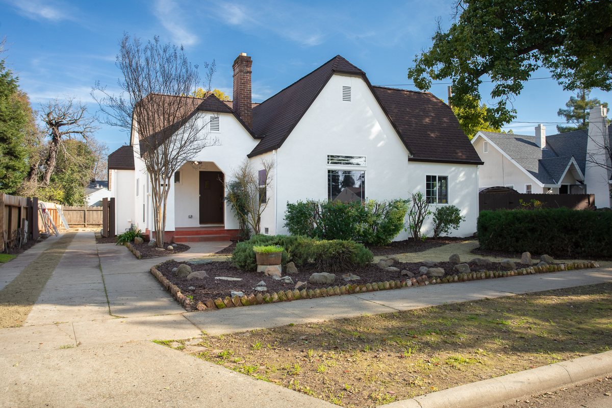The same Olive Street house after a fully permitted renovation, cleared and landscaped